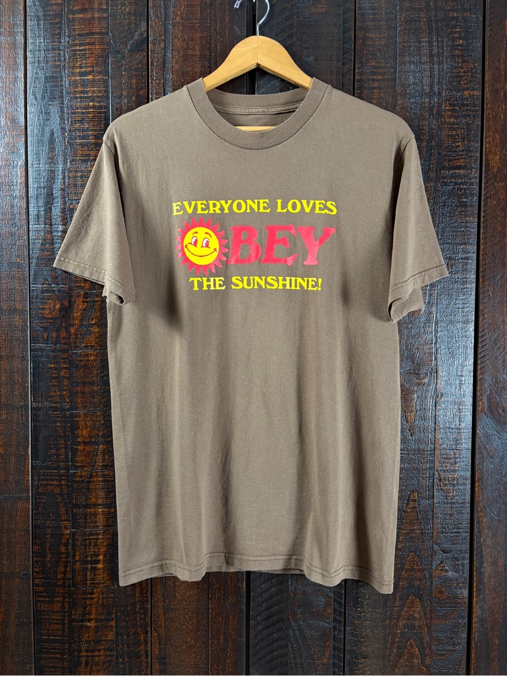 Obey Men’s Retro Brown Tee with Red & Yellow Sunshine Graphic Medium